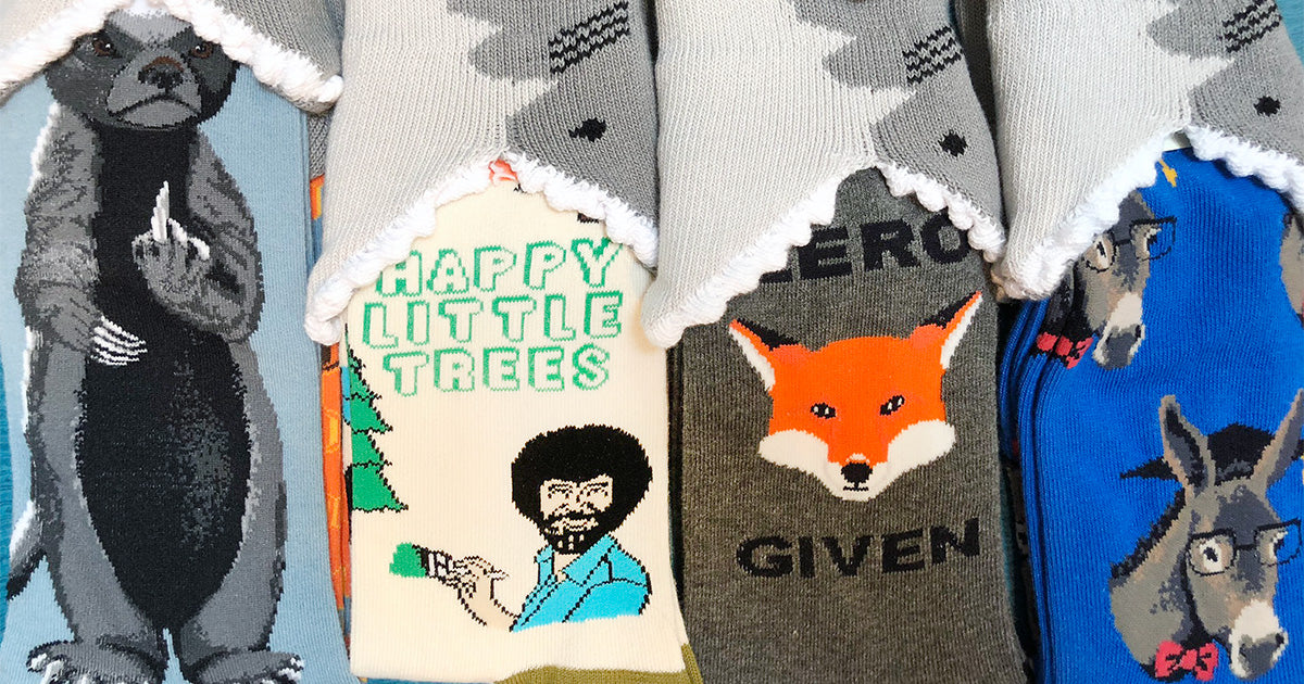 Funny socks including novelty 3D sharks, honey badger, animal puns and Bob Ross.