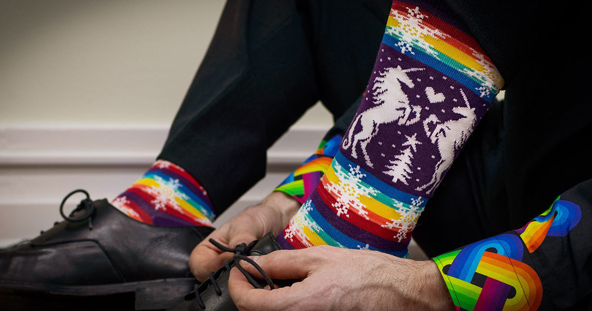 Gay unicorn ugly Christmas sweater socks for men with rainbow stripes.