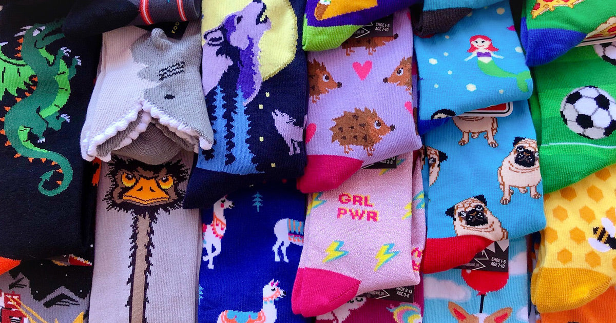 Fun, novelty kids' socks with animals, sports and girl-power designs.