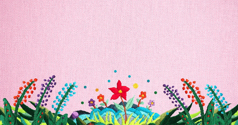 A colorful animation made from embroidered images illustrates mental health with a person's head popping up from a garden like a flower.