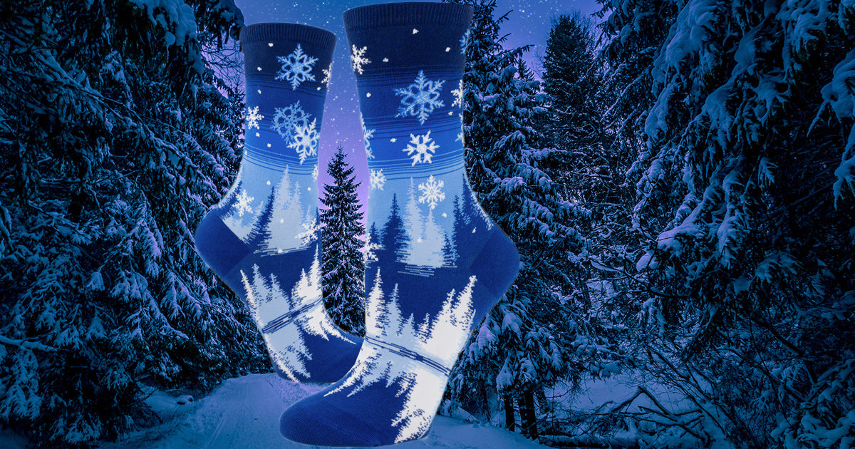 Christmas socks with white & blue snowflakes on a blue gradient stripe.