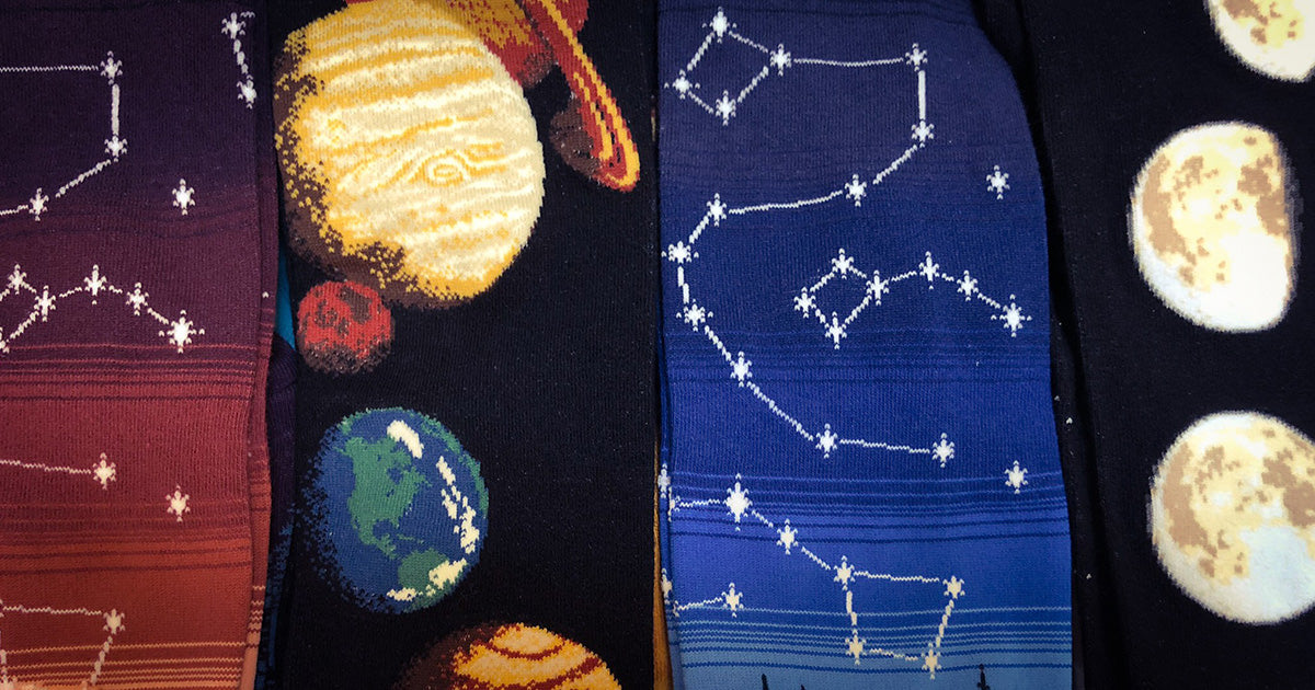 Space socks with constellations, planets and moon phases.