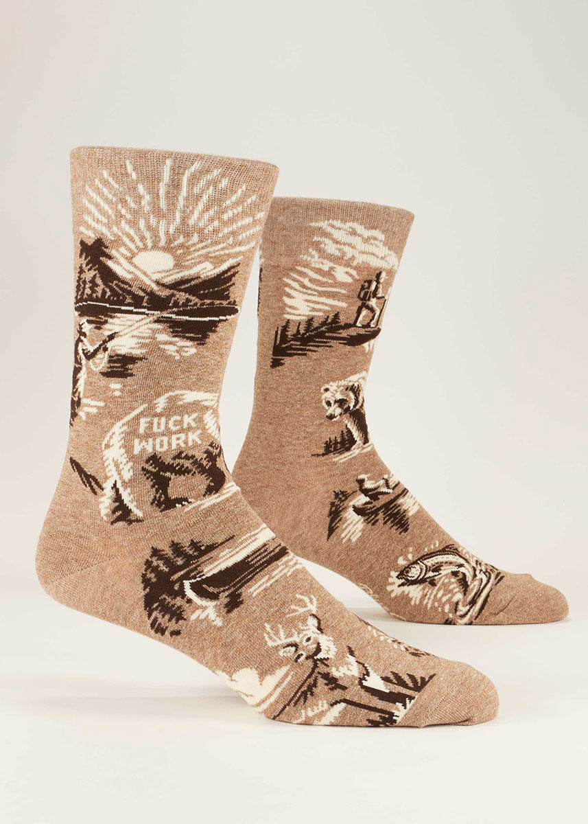 Light brown crew socks for men that say "Fuck Work"and show a woodland scene with a fisherman fishing in a lake against a mountain backdrop.