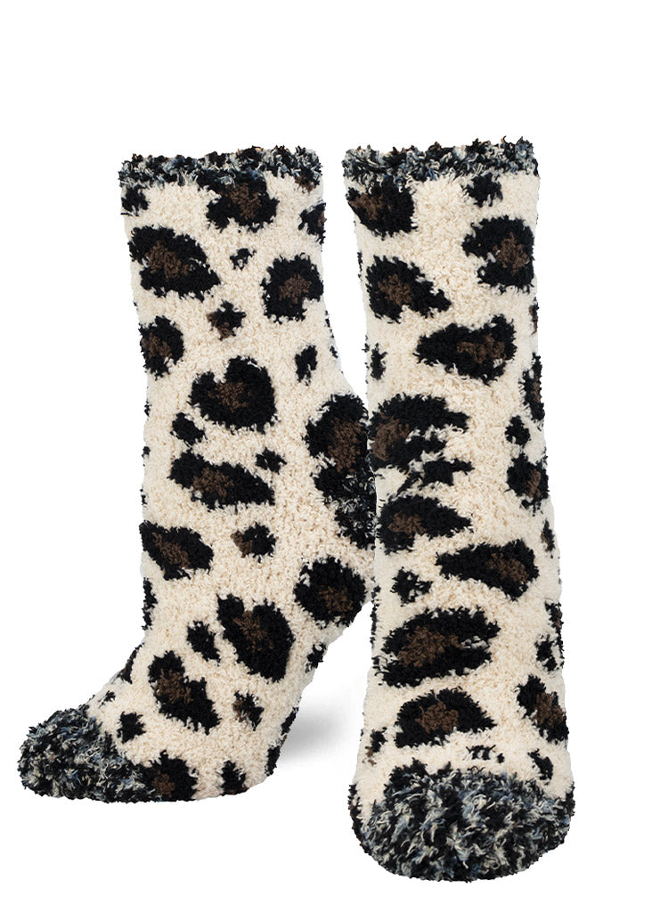 Fuzzy socks for women with an allover beige, brown, and black leopard print pattern.