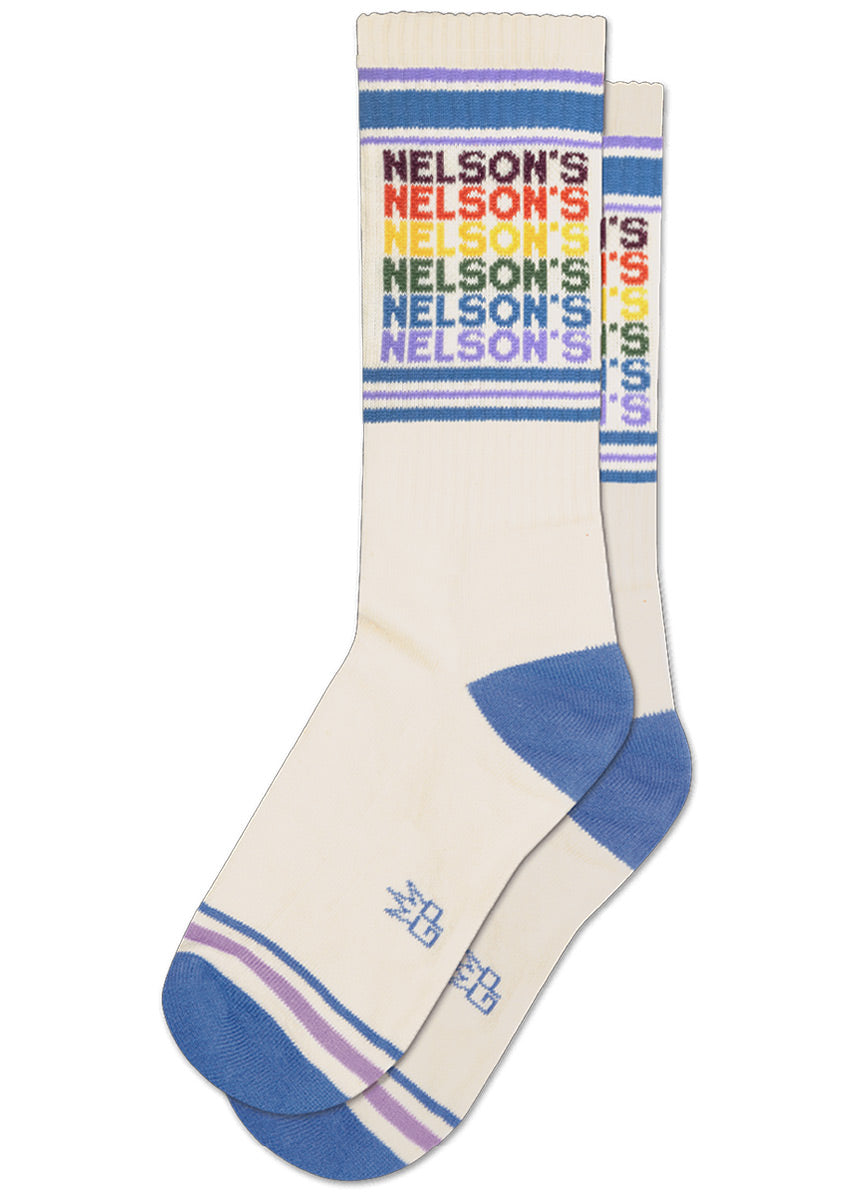 Cream retro-style gym socks with purple and blue accents feature vintage-inspired rainbow lettering spelling out “NELSON'S.”