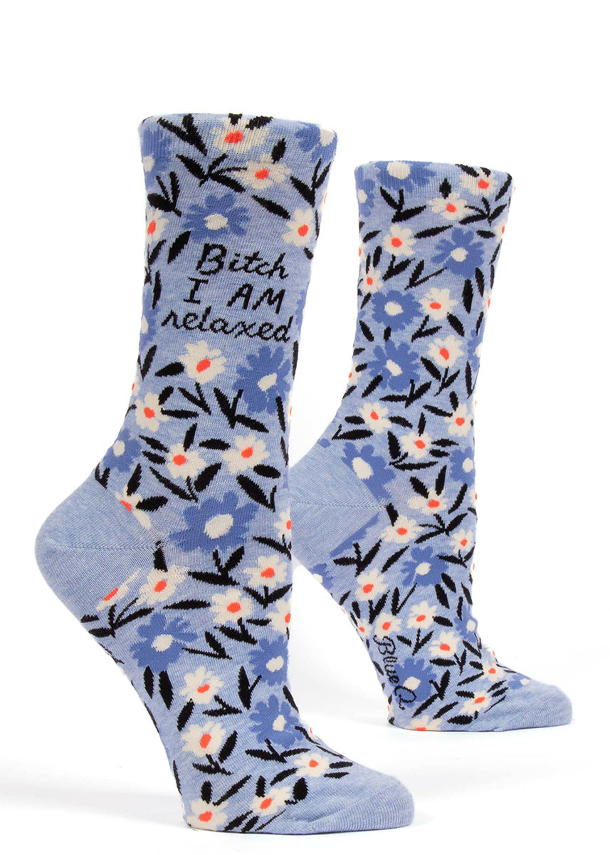 Bitch socks for women that say "Bitch I AM Relaxed" with a blue floral pattern