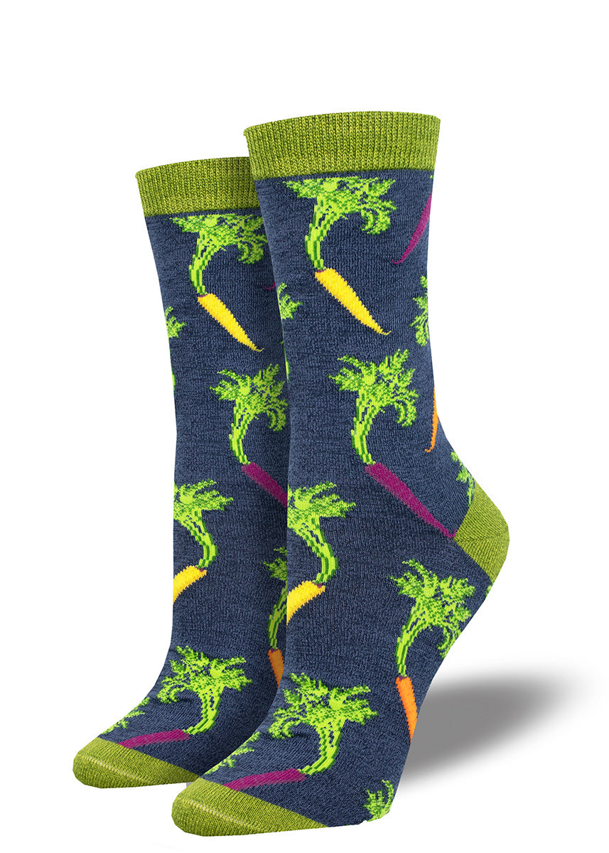 Navy women&#39;s crew socks with green accents feature a pattern of colorful carrots in yellow, orange and purple with their feathery tops still attached.