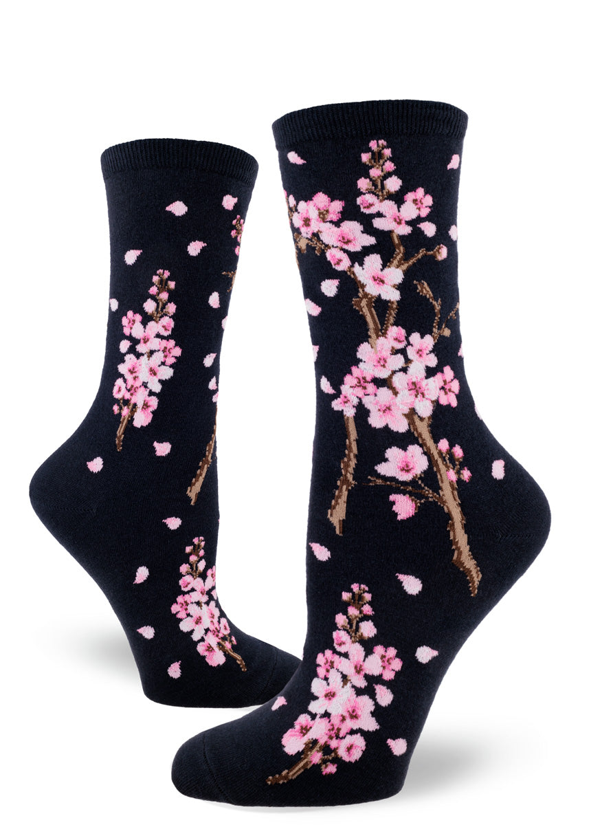 Spring socks for women with pink cherry blossoms on a deep navy background.