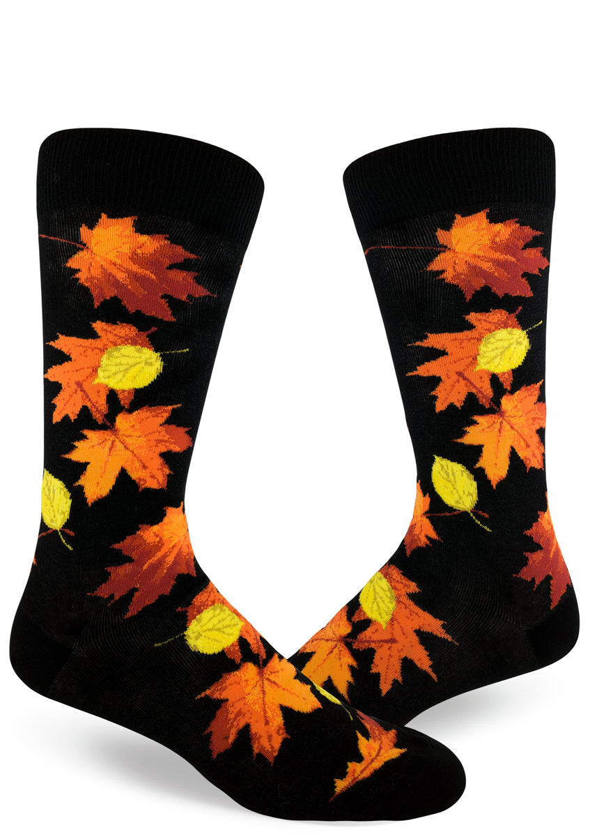 Fall leaves socks for men with orange, red and yellow leaves on a black background