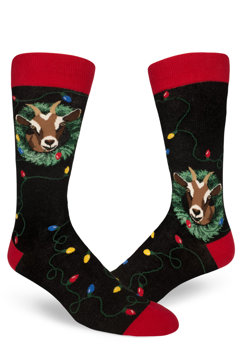Goats eat Christmas lights on our funny men's Christmas socks in black and red.