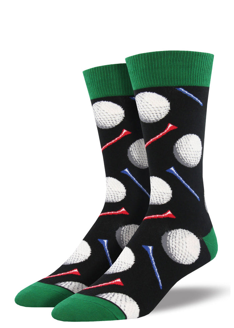 Golf socks for men with golf balls and golf tees, with a black background.