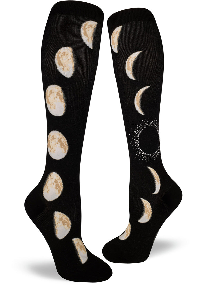 Moon phase knee high socks for women have moons from crescent to full moon running up the legs.