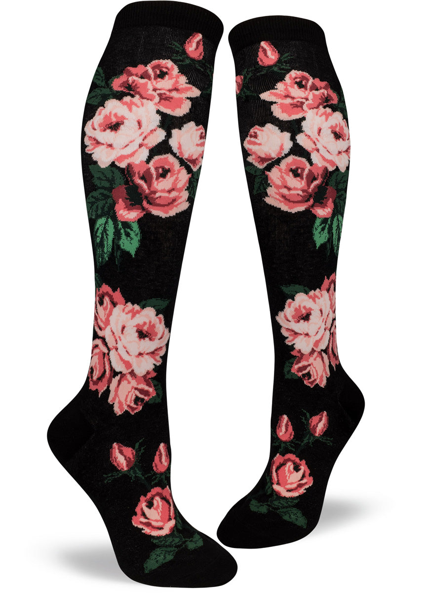Rose socks for women with pretty pink roses on a black & white striped background.