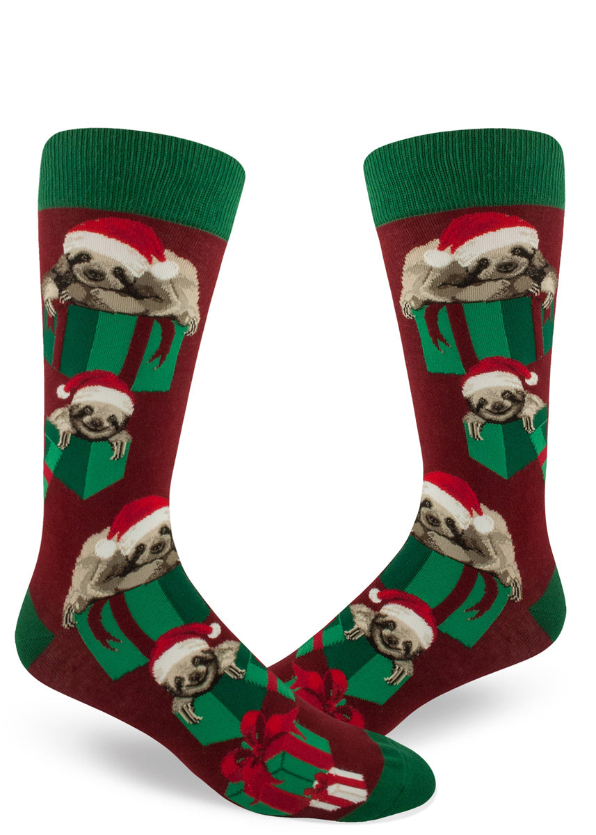 Christmas sloth socks for men with sloths in Santa hats and presents on a red background