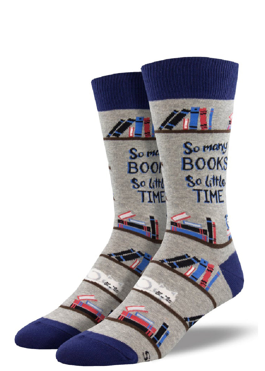 Fun book socks for men show shelves full of books (and a sleeping cat) with the words “So many books, so little time.”