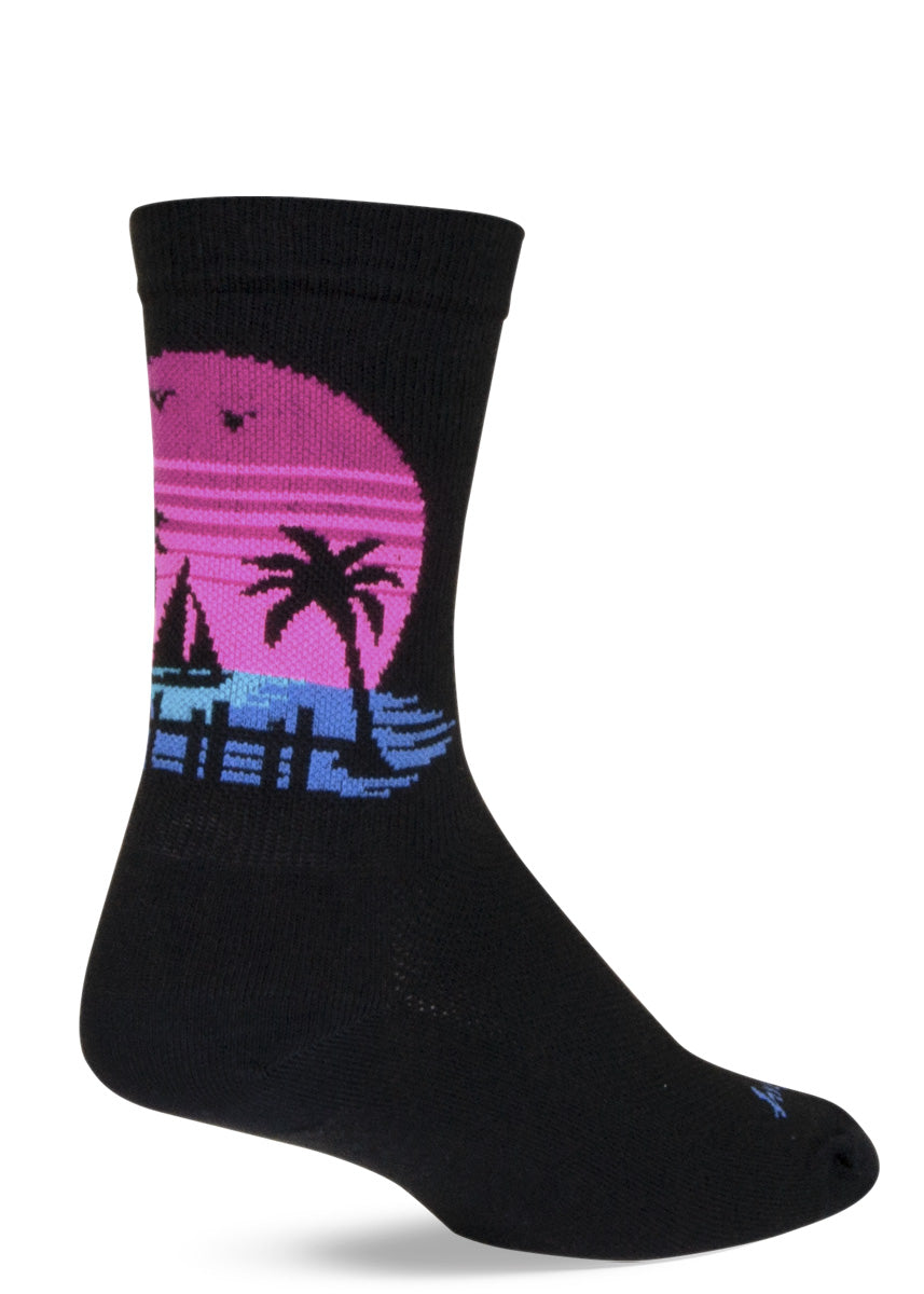 Performance athletic socks feature a sunset beach scene that looks like a skull from further away.