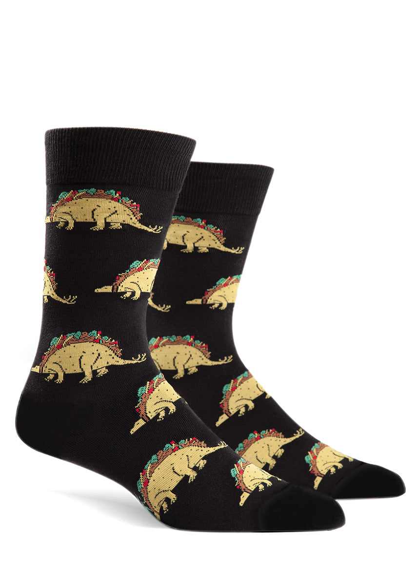 Tacosaurus men&#39;s socks with taco dinosaurs on a black background