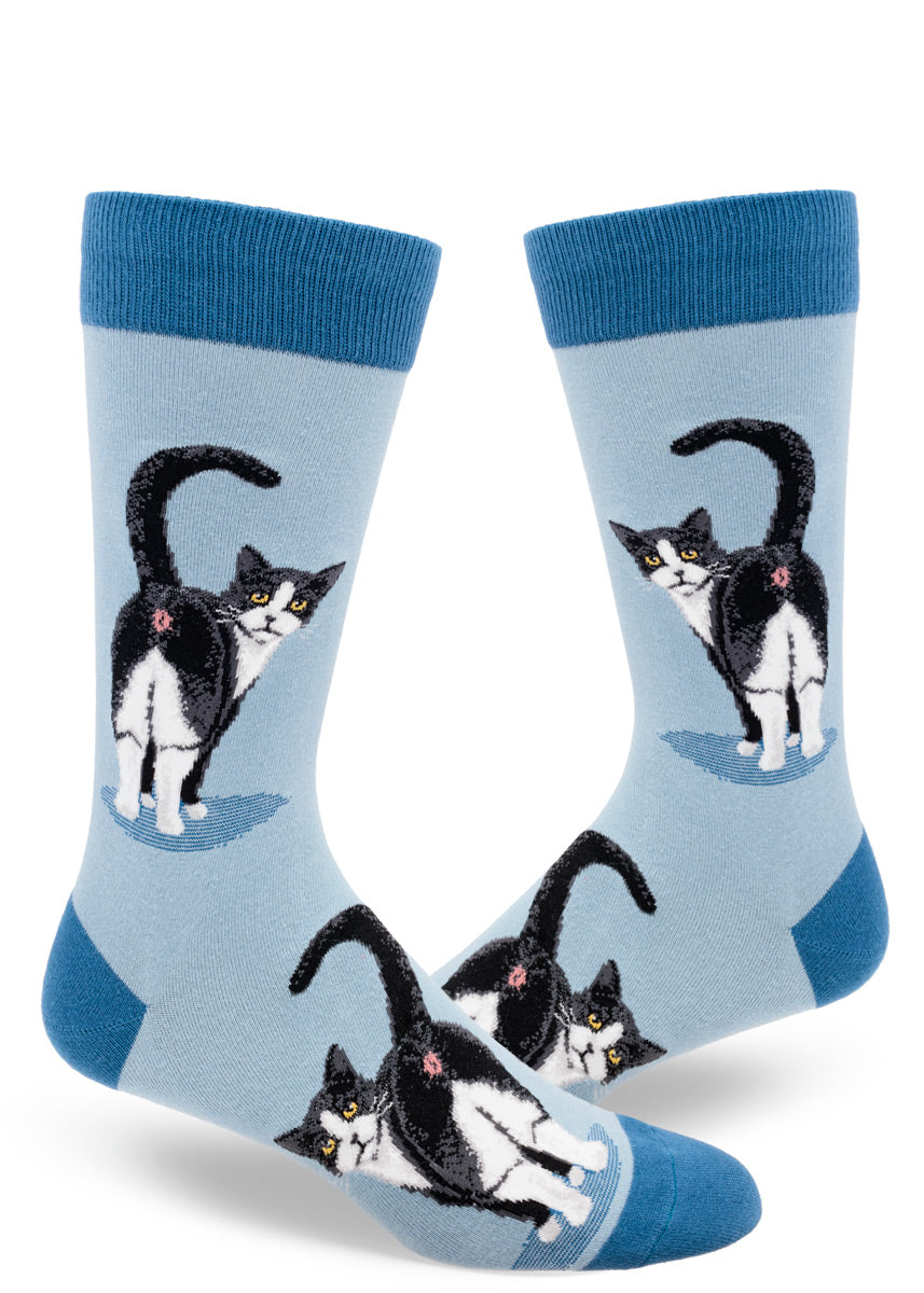 Slate blue men&#39;s crew socks with a design of tuxedo cats inviting you to peek at their butts.