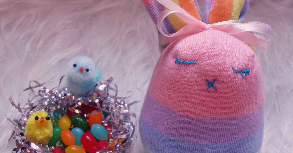 A DIY sock animal toy stuffed bunny and a little Easter basket of jelly beans