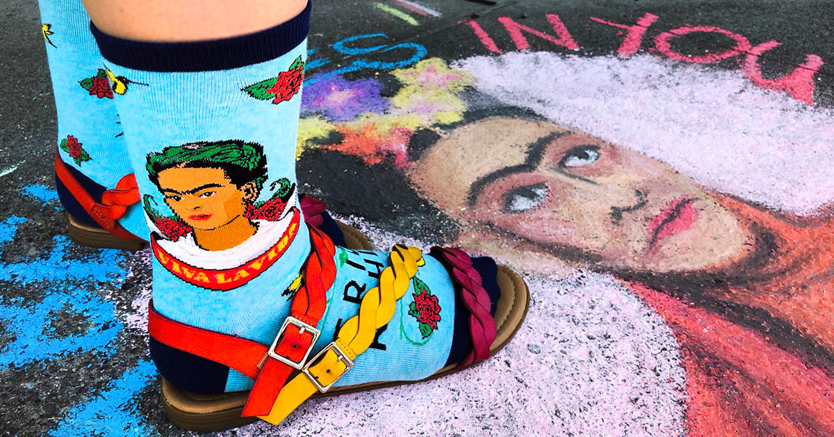 Frida Kahlo socks and Frida chalk art on a sidewalk