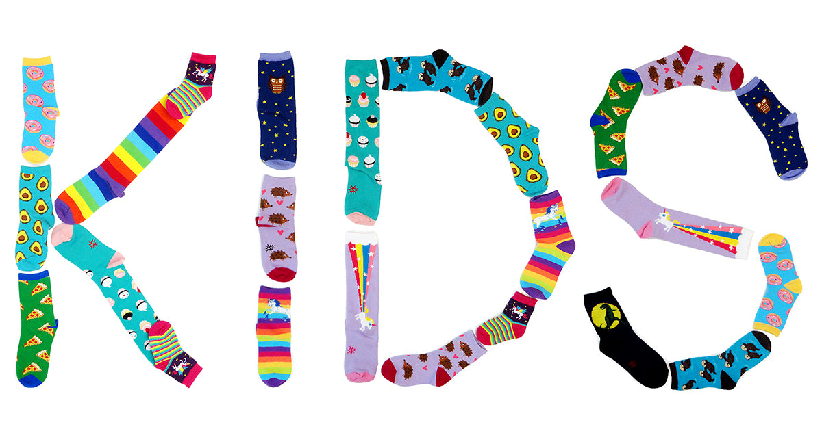 Socks for kids spell out the word KIDS