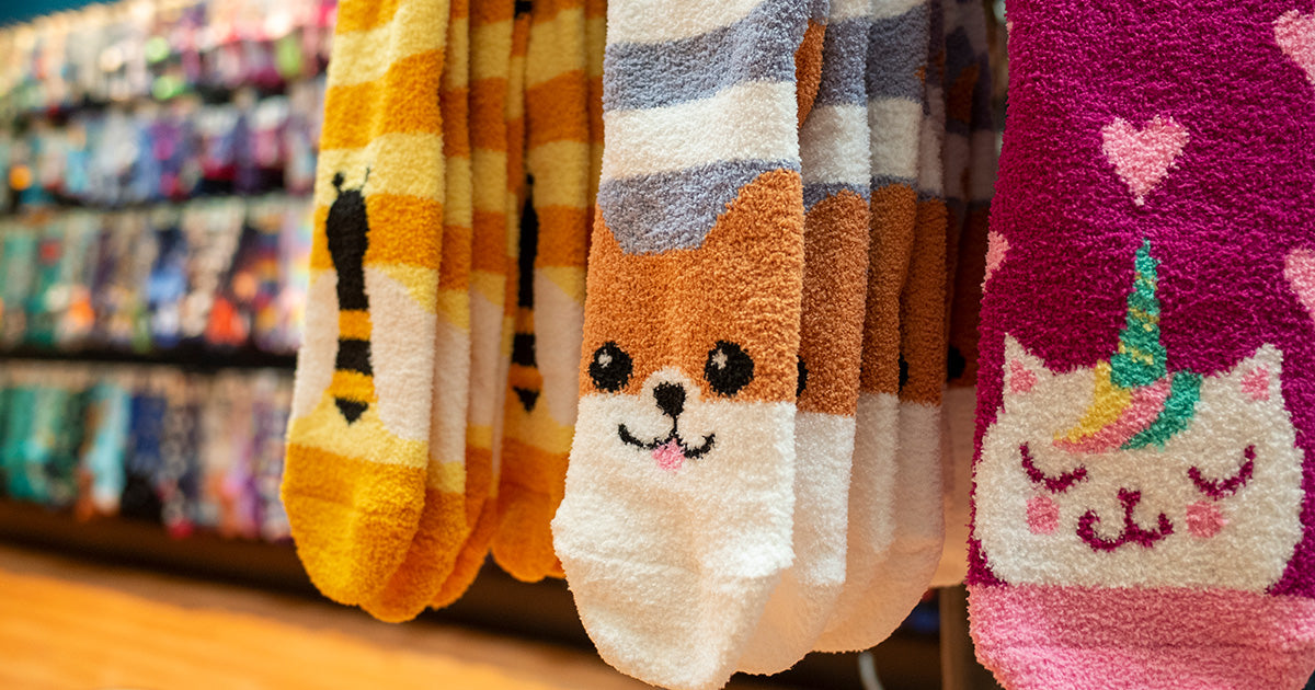 Soft and cozy slipper socks are trending for fall 2021, like these adorable gripper-bottom animal-themed styles.