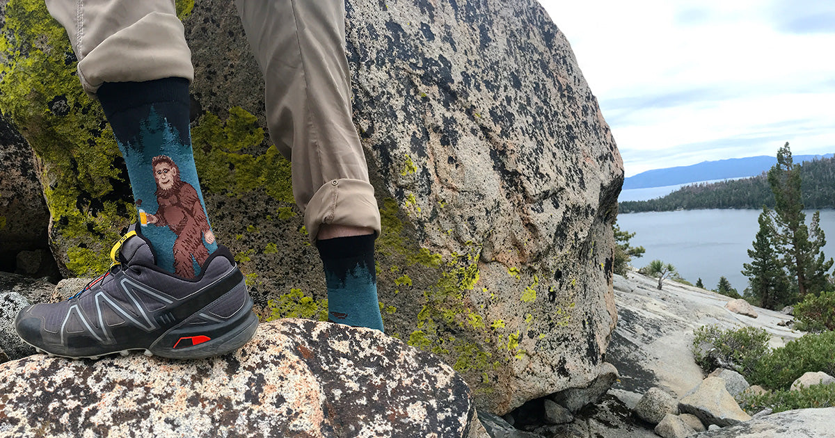 Sasquatch socks in the wild showing Bigfoot drinking beer