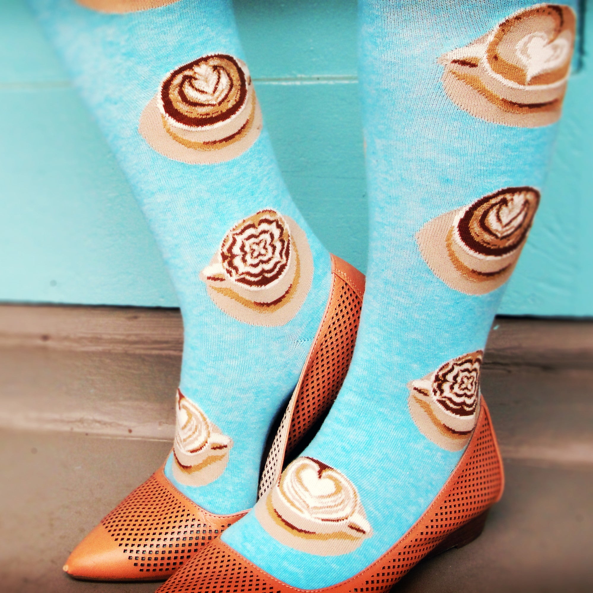 Coffee socks, like ModSocks' cute aqua knee socks featuring cups of latte art, are the best part of waking up.
