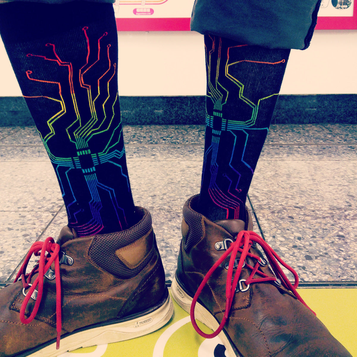 ModSock's collection of socks for grads includes these circuitboard socks with electronic circuitry in rainbow colors on a black background, perfect for any student or graduate into computers or electrical engineering.