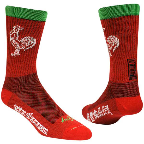 Siracha doesn't just go great on food, it also goes great on socks! These red hot sauce socks with a green cuff and white chicken are part of our collection by Sock Guy, and are one of many cozy wool socks made for performance or lounging around.
