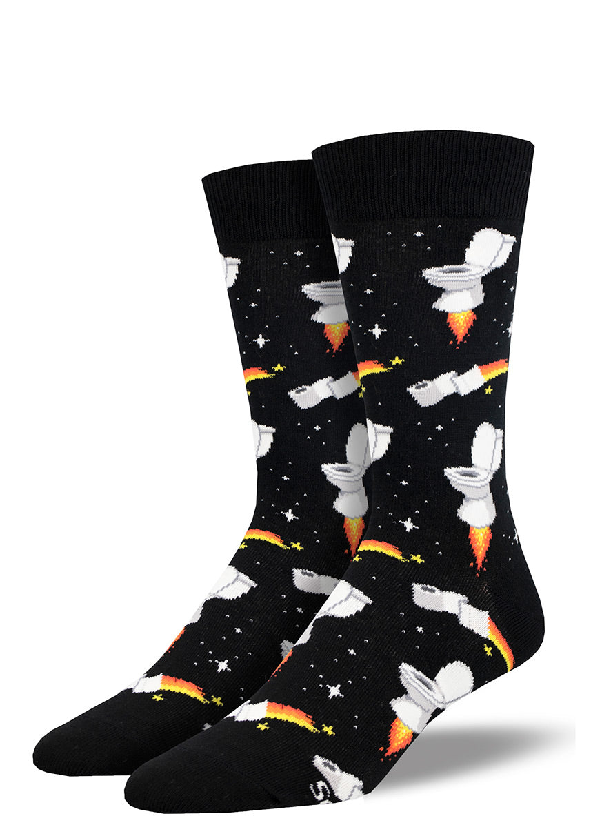 Men's crew socks feature jet-fueled toilets and flaming toilet paper rolls soaring like rocketships in a starry black background.