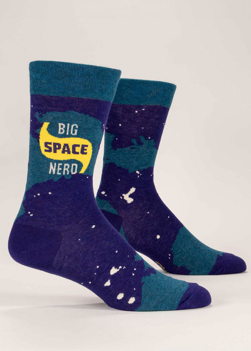 Navy and dark teal novelty crew socks for men that say "Big Space Nerd" against an abstract celestial pattern.