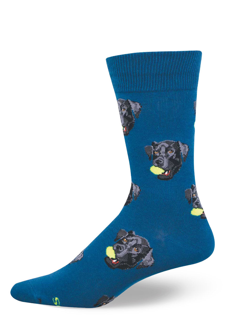 Teal blue men's crew sock with a repeating pattern of black lab dogs with tennis balls in their mouths.