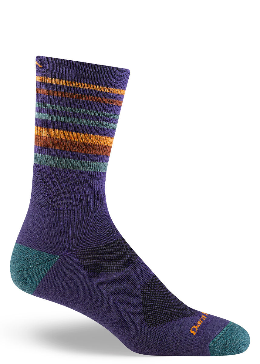 Crew-length hiking socks for men in royal purple with teal, red and orange stripes at the cuff, and teal accents at the heel and toe.