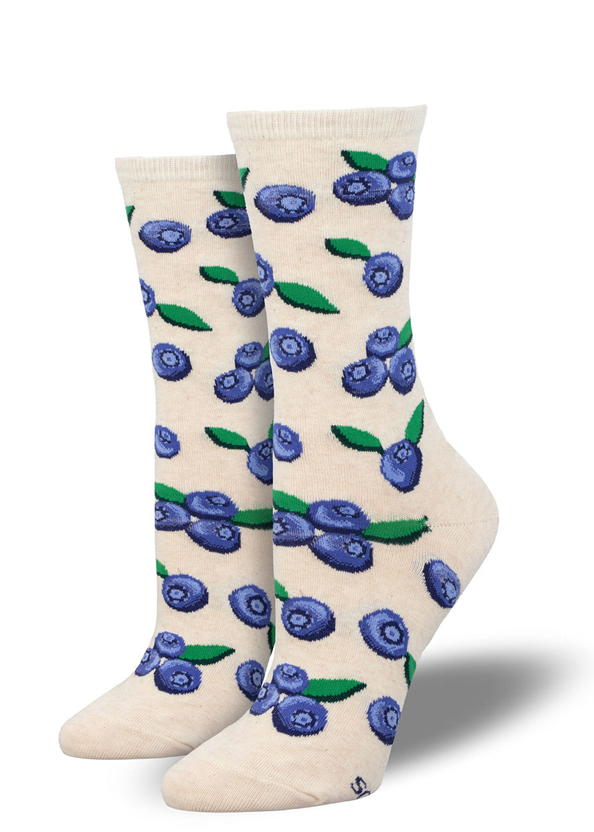 White crew socks for women with an allover pattern of blueberries.