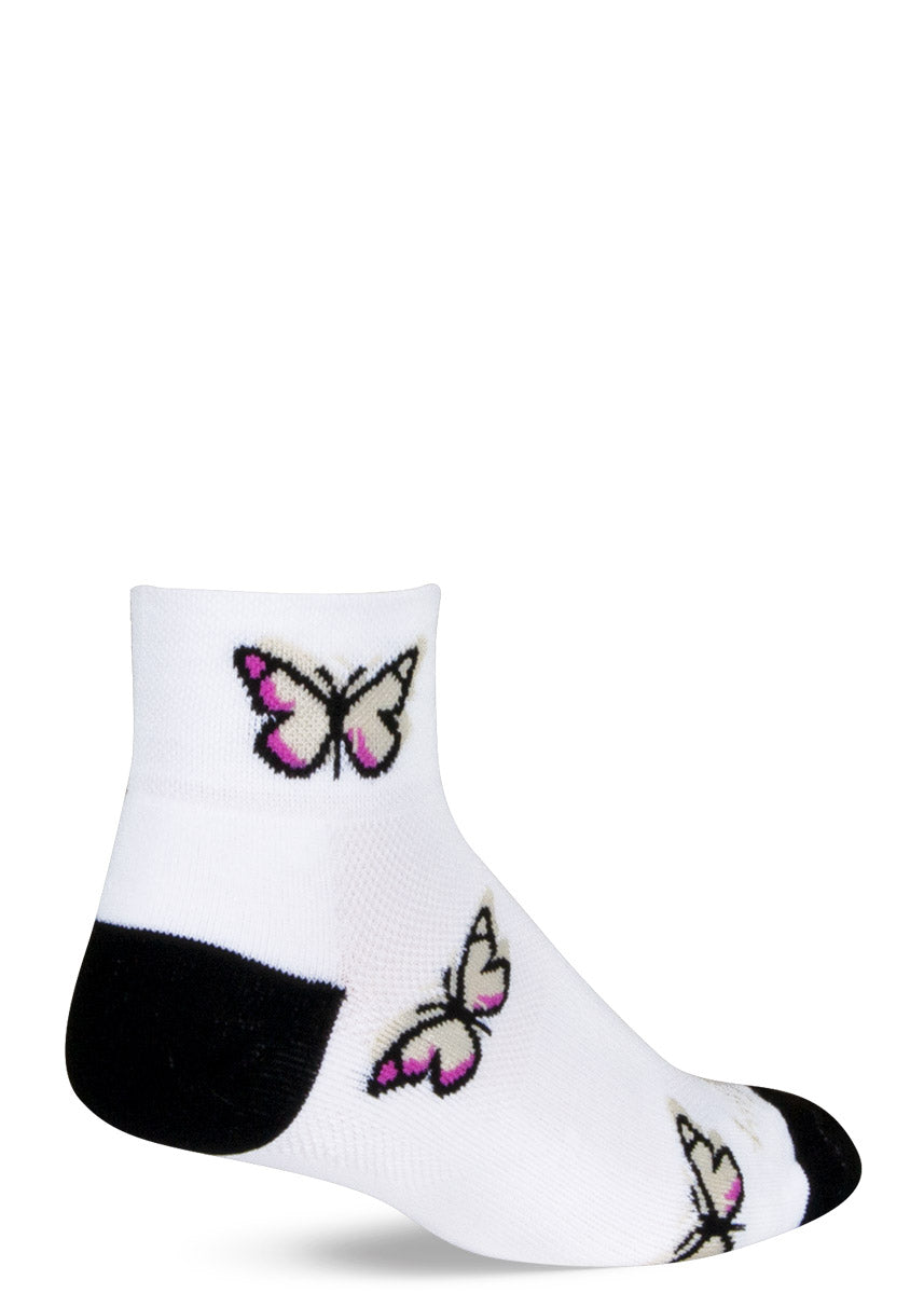 White athletic ankle socks for women with a repeating pattern of pink and beige butterflies.