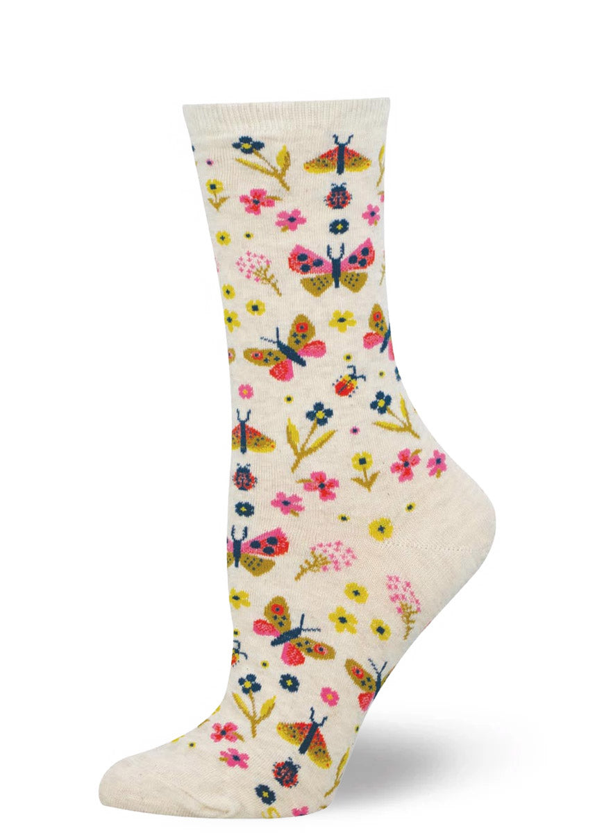 Floral and butterfly-patterned women's crew sock on a white background.