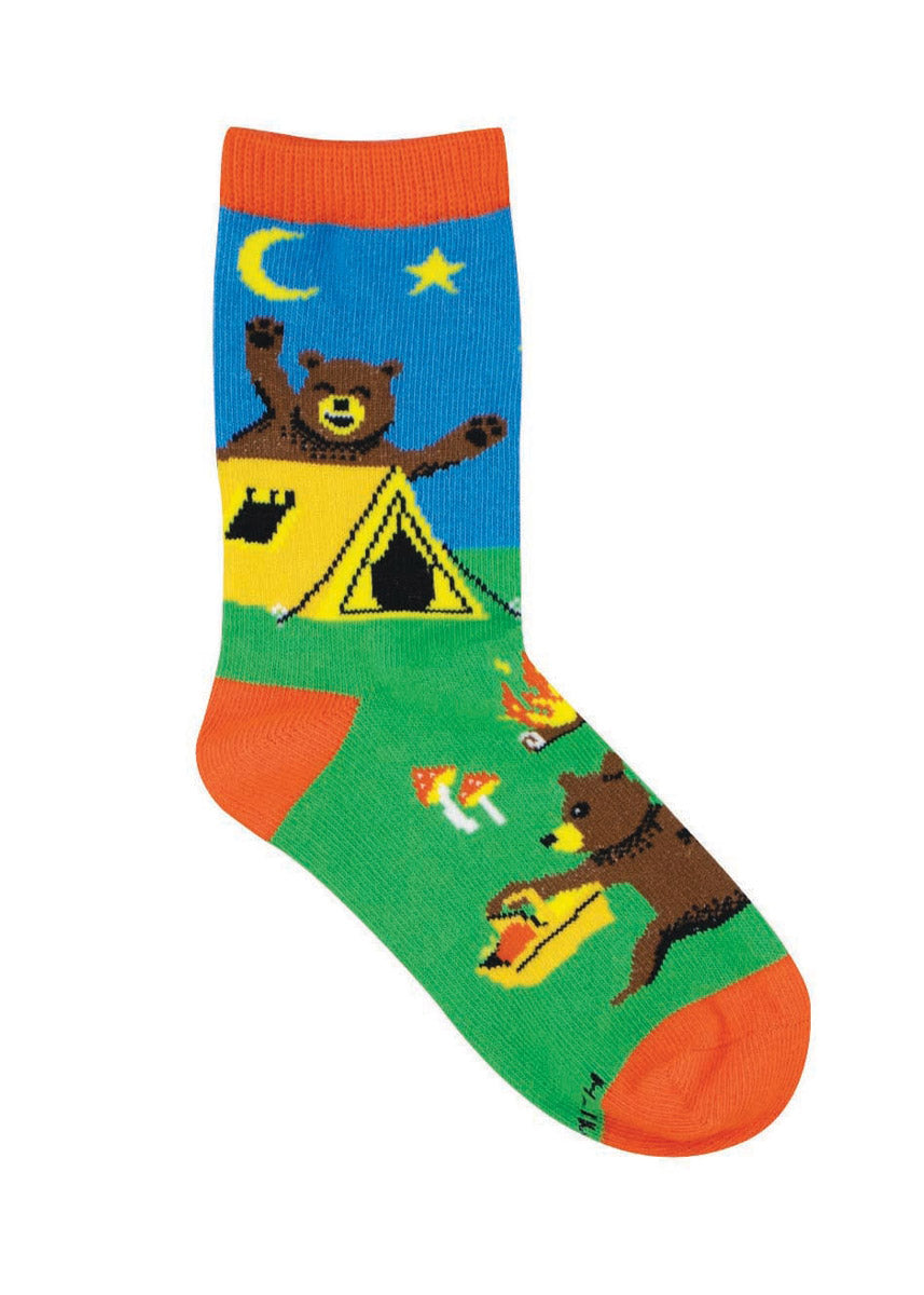 Blue and green crew socks for kids with two brown bears at a campsite.