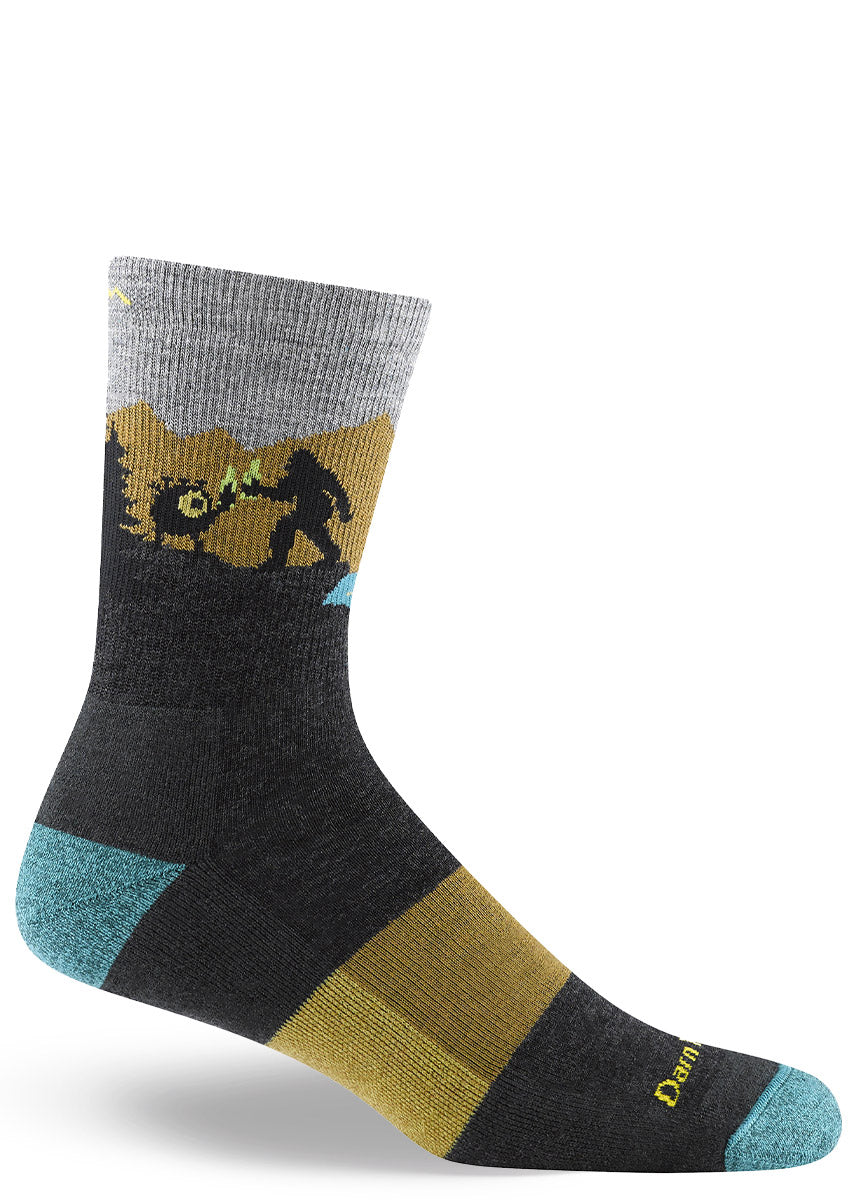 Men's crew hiking socks depict Sasquatch and an alien drinking beer while the Loch Ness Monster looks on, in shades of gray, gold and aqua.