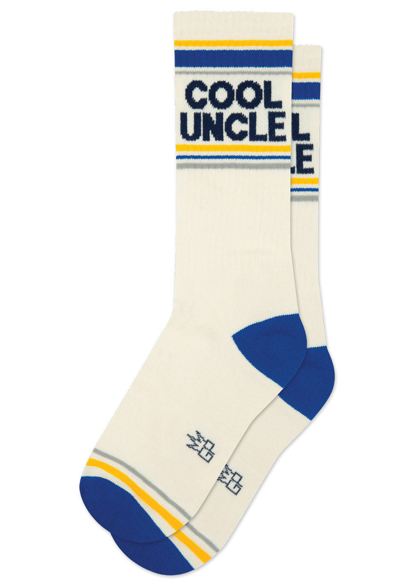 Cream-colored retro-striped athletic socks with blue and yellow accents and 'COOL UNCLE' text at the cuff.