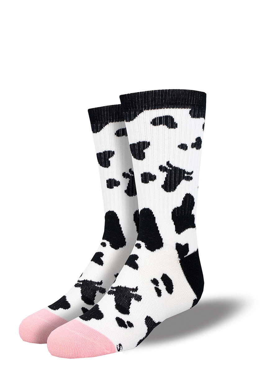 Cow athletic socks for kids with black &amp; white cow spots, with some of the black spots shaped like a cow head, and a pink toe.