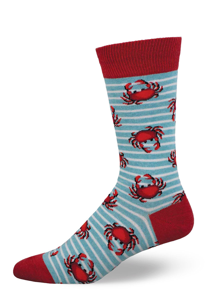 Light blue and white striped socks for men with a red cuff, toe, and heel and allover pattern of red crabs.