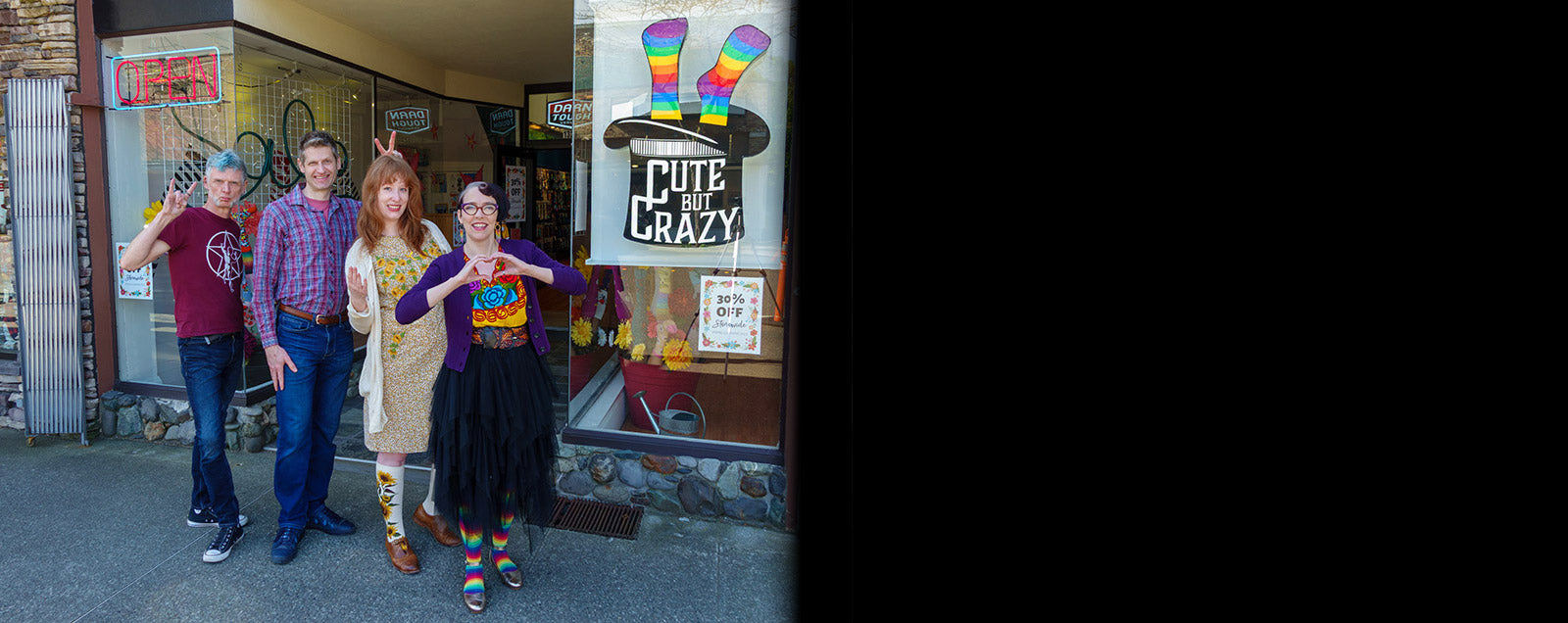 Staff pose in front of 'Cute But Crazy,' a sock store in downtown Bellingham, Washington.