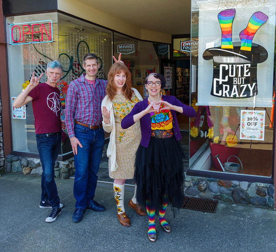Staff pose in front of 'Cute But Crazy,' a sock store in downtown Bellingham, Washington.