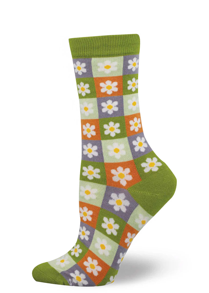 Colorful checkered sock with daisy pattern on a white background.