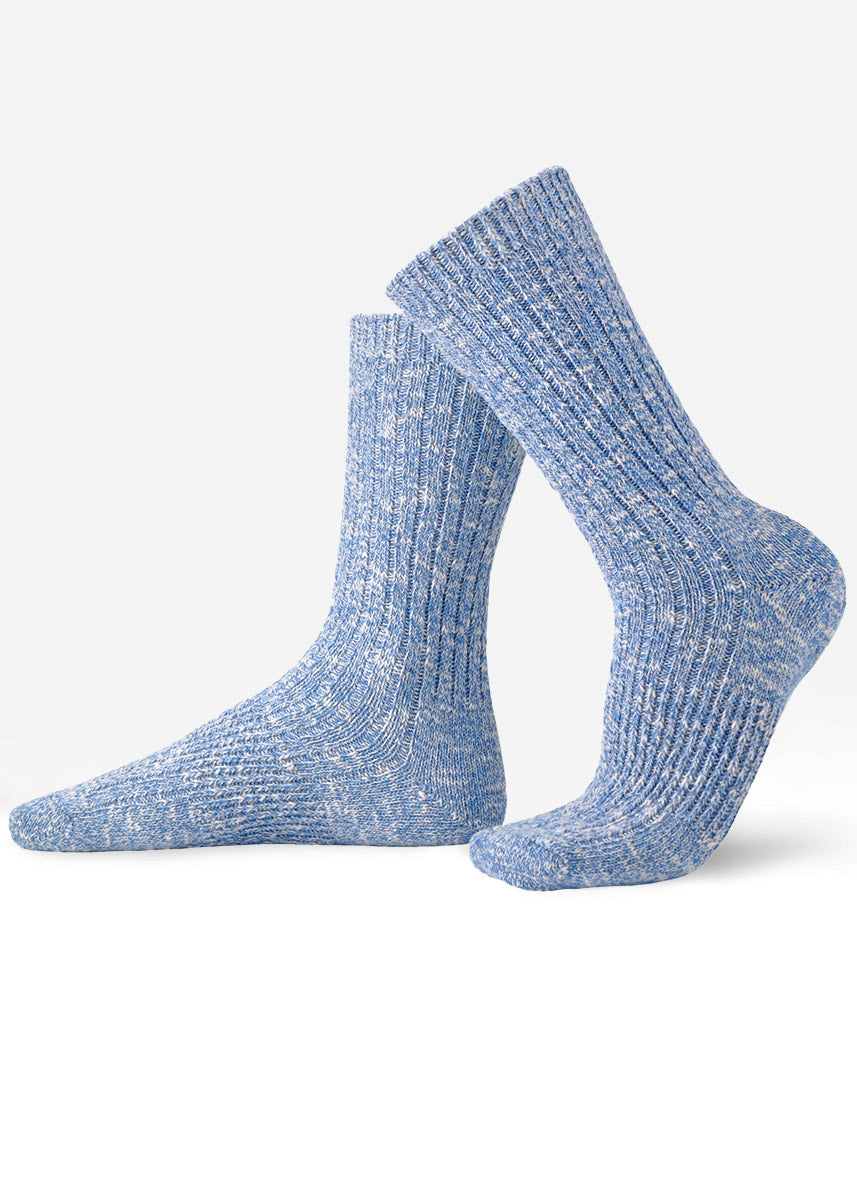 Blue slouch crew socks with a ribbed slub-knit texture and mottled, heathered coloring.