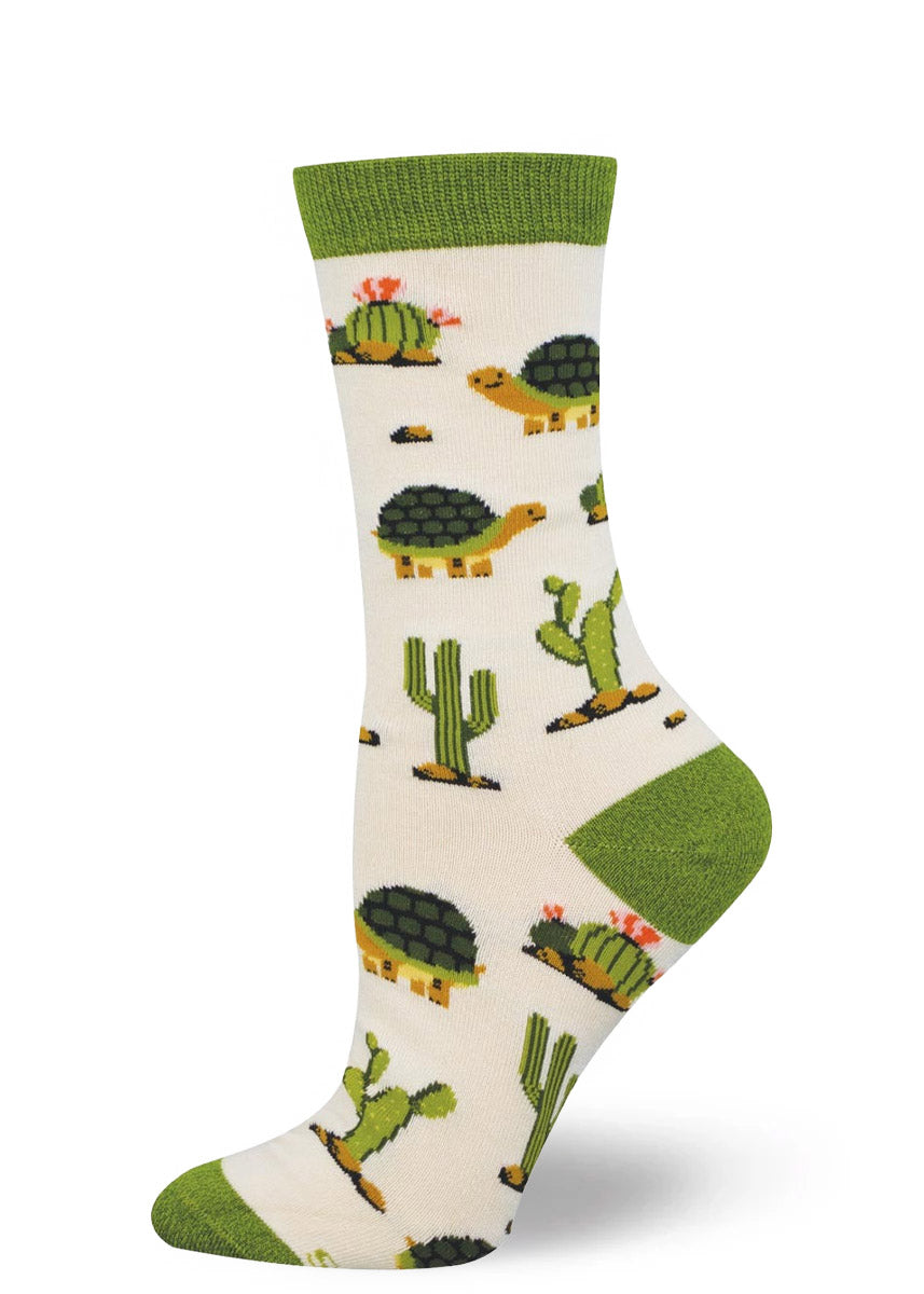 White crew sock with cactus and tortoise or turtle design on a white background.