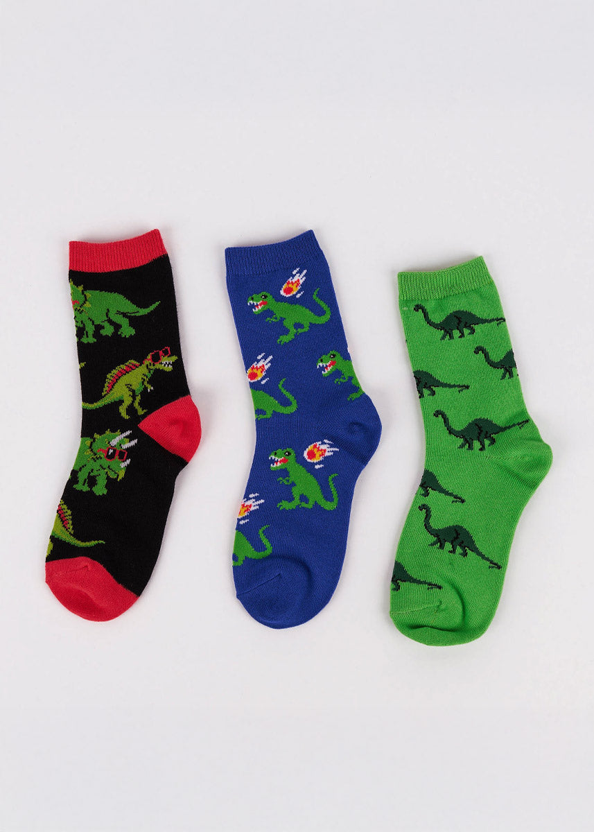 Three pairs of kids' crew socks with dinosaur patterns on a white background.