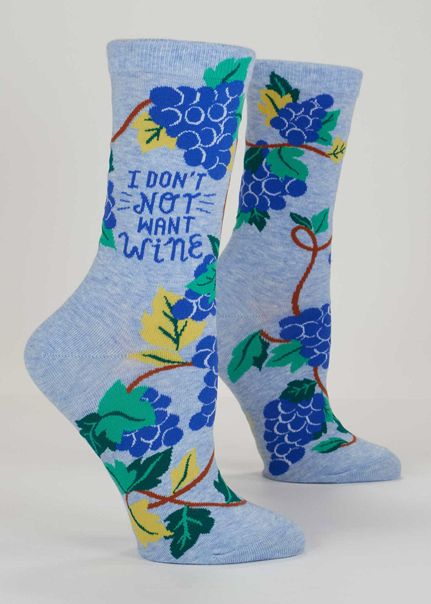 Light blue crew socks for women with an allover pattern of grapes on the vine and the words "I don't not want wine."