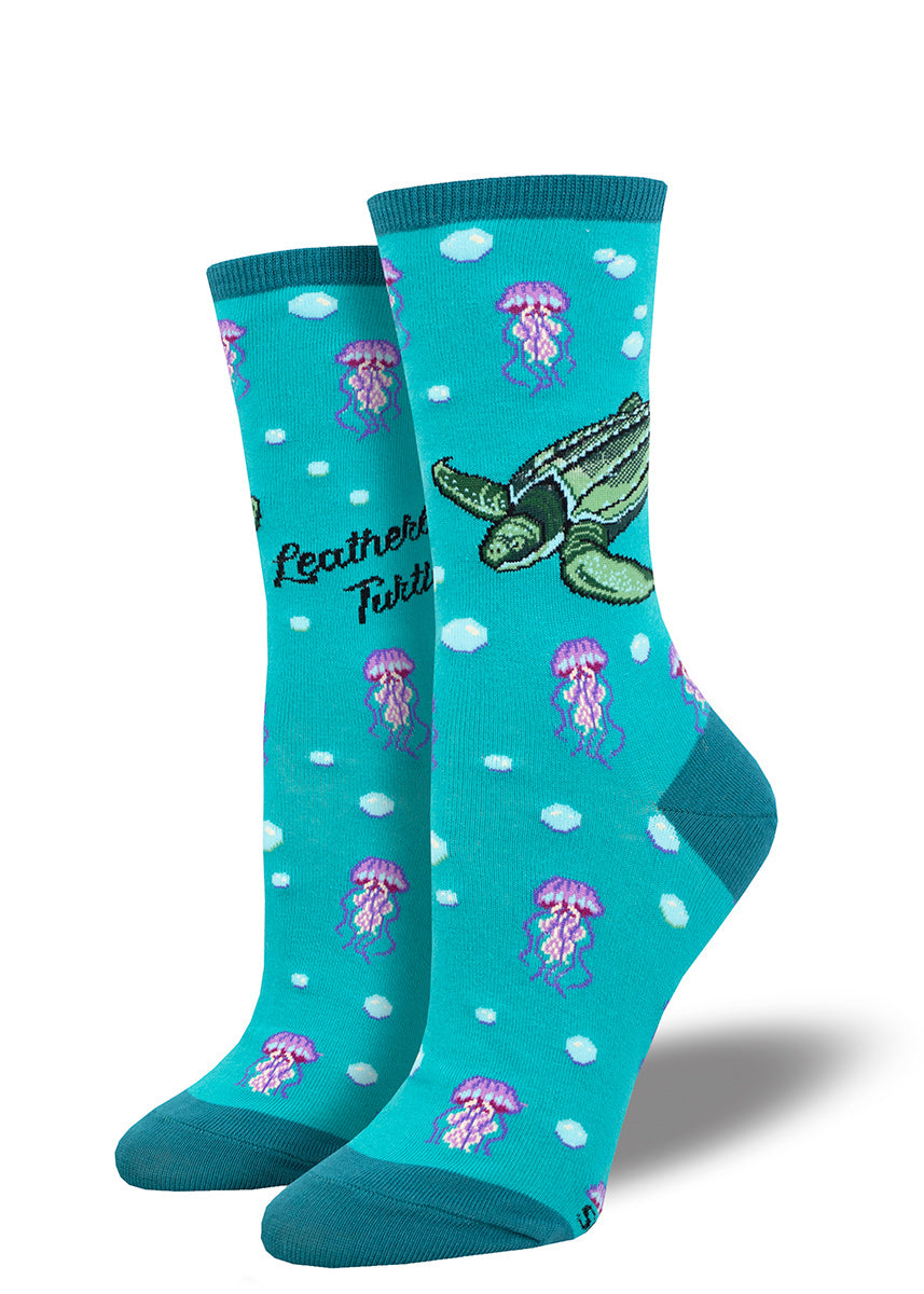 Teal crew socks for women with a design of turtles, jellyfish and underwater bubbles.